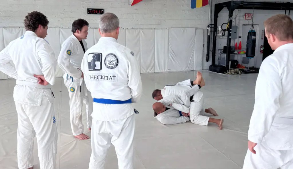 Students training in Fundamental BJJ class